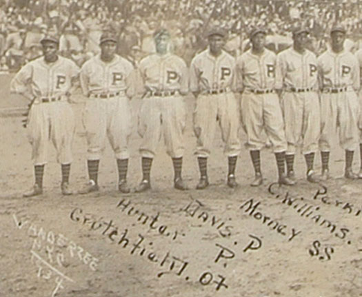 The 1932 Pittsburgh Crawfords, featuring 3 of the greatest players ever: Satchel  Paige is standing third from the left, Josh Gibson is standing next to Paige  and wearing a jacket, and Oscar